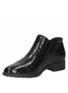 Zapato urbano negro de charol, suela plana y cremallera, ideal para combinar con jeans o atuendos más refinados.