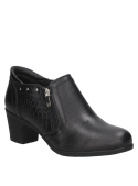 Botín negro de cuero para mujer con diseño moderno y elegante, cierre lateral de cremallera y relieve tipo piel de reptil.