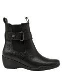 Botín Chelsea negro de cuero para mujer, ideal para invierno, combina estilo y confort.