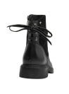Calzado casual de cuero negro para mujer con suela moderada y tacón bajo ancho, brindando estabilidad y comodidad.