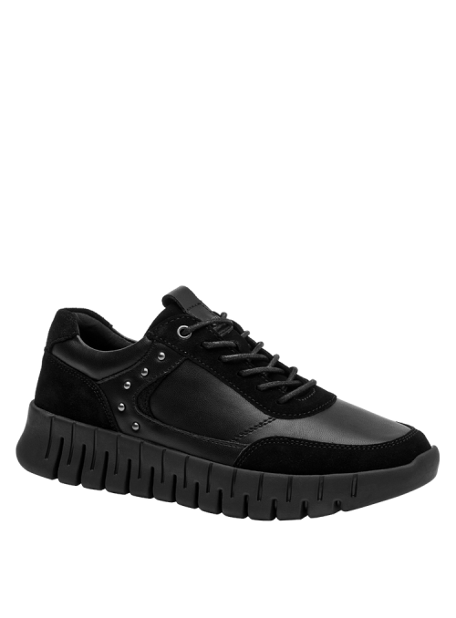 Zapatilla casual negra de mujer, combinando materiales suaves y gamuza, perfecta para uso cotidiano e informal.