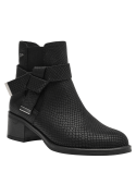Versátil botín Chelsea de cuero negro para mujer, con detalles elegantes y taco que ofrece comodidad y estabilidad.