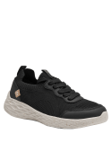 Zapatilla negra de mujer con suela gruesa espumosa, proporciona amortiguación y comodidad, ideal para caminar.
