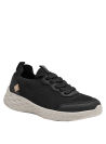 Zapatilla negra de mujer con suela gruesa espumosa, proporciona amortiguación y comodidad, ideal para caminar.