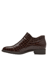 Zapato café de charol para mujer, con cremallera lateral en cuero, combina estilo moderno y comodidad urbana.
