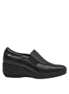 Zapato de mujer en cuero negro con detalles elásticos, estilo clásico y moderno a la vez.