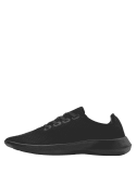 Zapatilla deportiva negra para mujer, con suela acolchada que ofrece comodidad y absorbe impactos, perfecta para uso diario.