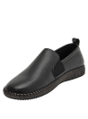 calzado de cuero negro mate para mujer, costura visible en la suela, estilo normcore.