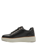Elegante zapatilla negra de cuero para mujer, perfecta para estilo athleisure.