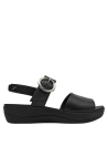 Calzado casual de cuero negro con hebilla grande, ideal para ocasiones informales y semi-formales.