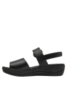 Calzado casual de cuero negro con diseño minimalista y hebilla lateral para mujer.