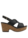 Sandalia negra de cuero versátil, perfecta para eventos casuales o semi-formales.