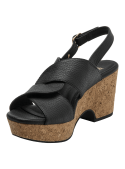 Sandalia de cuero negro para mujer con tiras cruzadas y hebilla dorada, estilo casual y sofisticado.