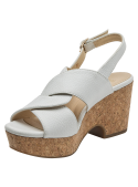 Sandalia de cuero blanco con plataforma de corcho y cuña, ideal para looks veraniegos.