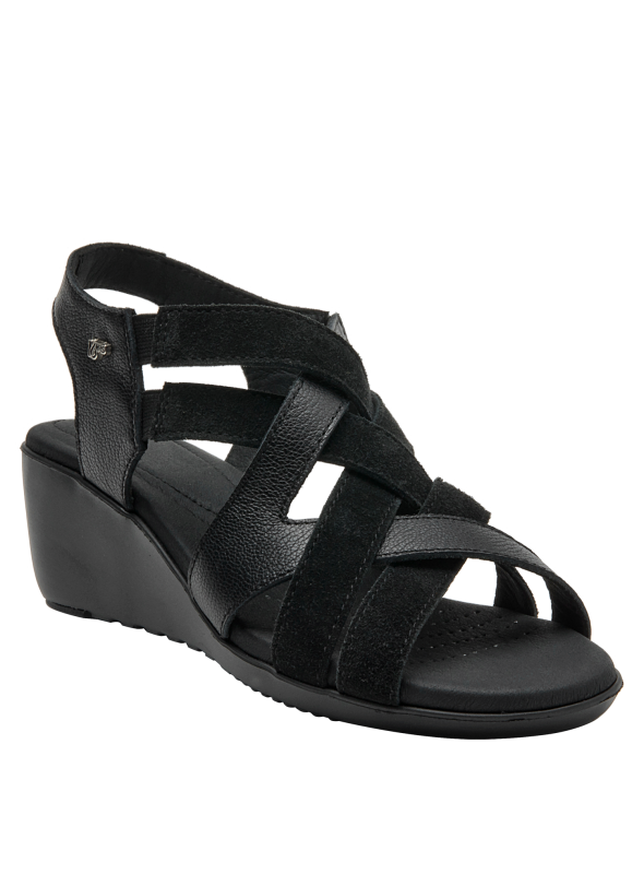 Sandalia de cuero negro, diseño elegante con detalles en gamuza y acabado mate.