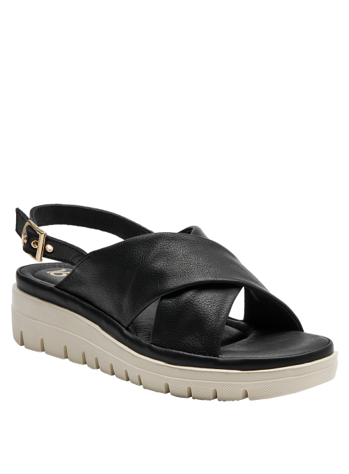 Sandalia casual de cuero negro con suela blanca, perfecta para días calurosos.