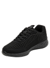 zapatilla de mujer negra con suela salpicada en blanco/gris, perfecta para un estilo casual y moderno.