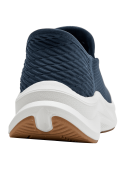 zapatilla azul marino slip-on de mujer con tejido de malla y suela blanca ondulada contrastante