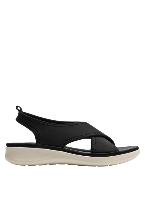 Sandalia deportiva negra de mujer con correas anchas cruzadas y suela blanca crema estilo plataforma.