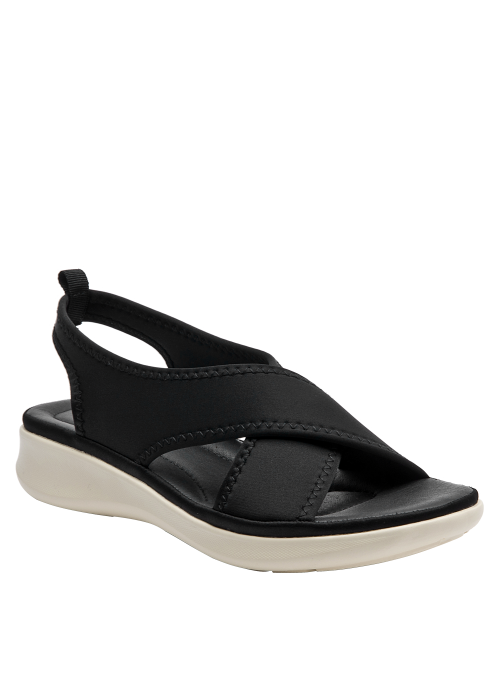 Sandalia deportiva negra de mujer con correas anchas cruzadas y suela blanca crema estilo plataforma.