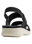 Minimalista sandalia negra de mujer, ideal para looks versátiles y modernos.