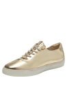 elegante zapatilla deportiva dorada de cuero con detalles mínimos y diseño moderno