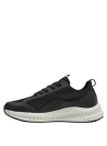 Zapatilla negra con cordones negros y detalles blancos, suela blanca gruesa y texturizada.