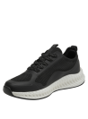 Zapatilla negra deportiva de mujer con exterior textil y detalles de malla para ventilación.