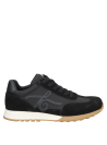 Zapatilla negra de mujer con estilo elegante y funcional para el día a día.