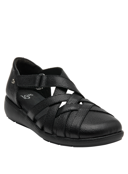 Sandalia plana negra de cuero, ideal para outfits relajados y pulidos.