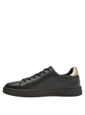Zapatilla casual negra para mujer, detalles dorados, ideal para combinar con jeans.