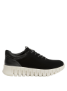 Zapatilla mujer negra de cuero, perfecta para combinar con jeans.