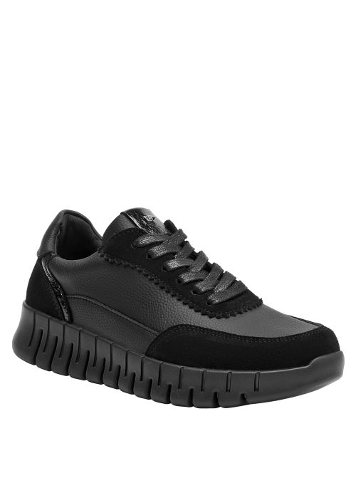 Zapatilla cuña negra de cuero para mujer, con plataforma, combina con jeans o vestidos relajados.