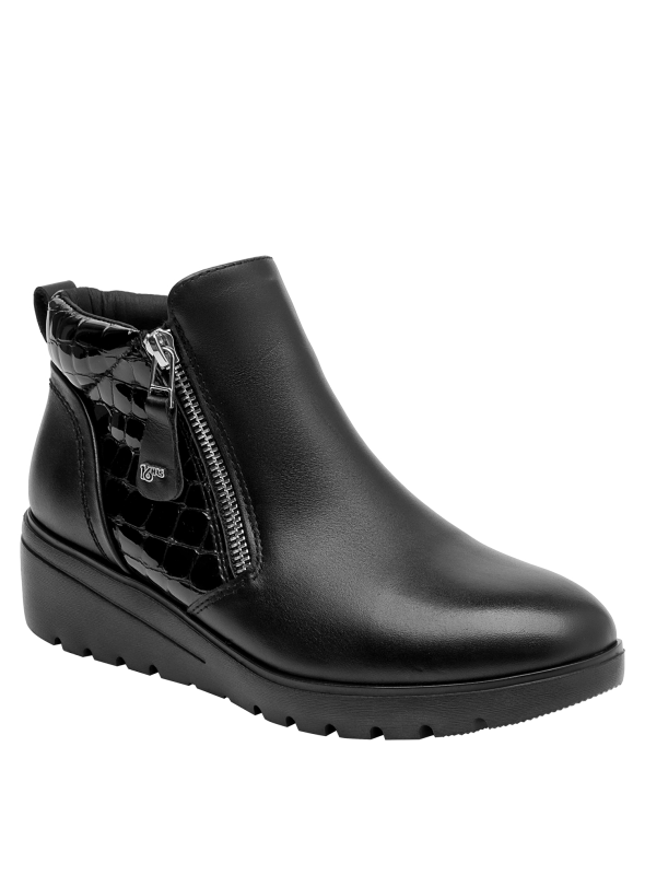 Botín de cuero negro para mujer, diseño anatómico, ideal para un look cómodo y moderno.