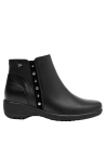 Botín negro con detalles de remaches sutiles, ideal para un look urbano y original en mujeres.