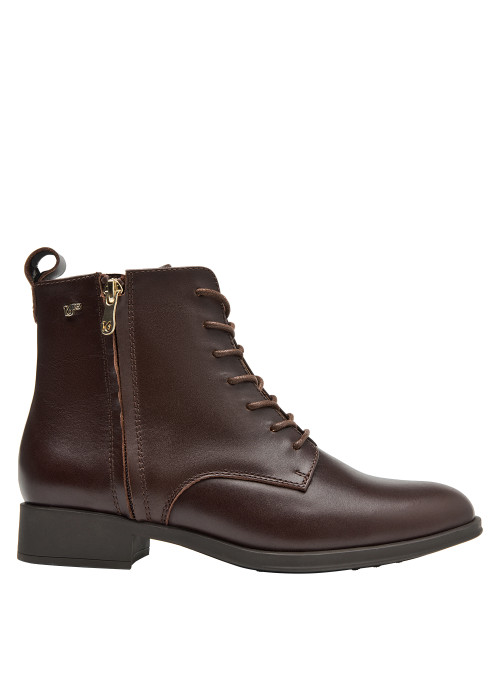 Botines de cuero café para mujer, estilo casual, recomendados para combinar con jeans o vestidos.