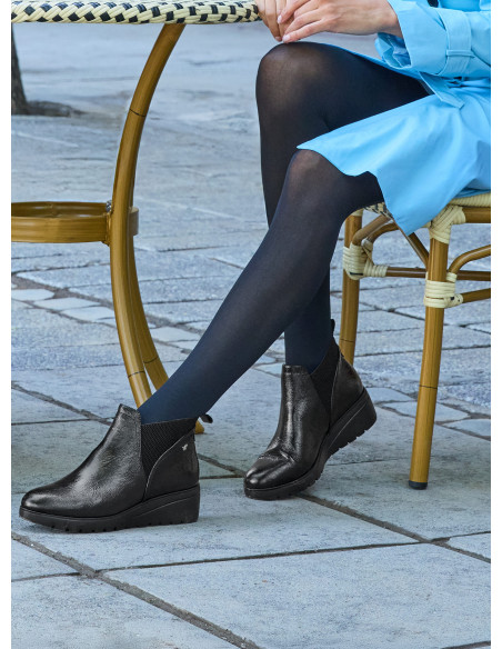 Botines de cuero negro para mujer, estilo casual, ideales para uso diario.