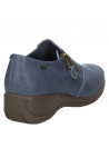 Zapato de cuero azul para mujer, estilo urbano, con banda elástica y detalle lateral funcional.